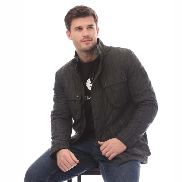 Mens Belstaff Hollingworth Plaid Waxed Cotton Fieldmaster Jacket in charcoal.- Centre front zip fastenings with snap closure placket and buckle-adjusted collar.- Signature tilted left breast pocket.- Four modern  storm proof bellows pockets with dual press stud closure.- Water resistant.- Wind repellent.- Internal drawcord waist channel.- A yarn-dyed cotton plaid with a full water-resistant coating.- Lightly padded tile quilt lining.- Silicone phoenix logo on felt base patch on left sleeve.- High-shine snaps and dark iron hardware.- Shell: 100% Cotton  Body Lining: 100% Cotton- Ref: 105289CHBLK