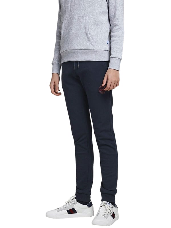 Effen joggingbroek met elastiek in de taille, trekkoord en geribde boorden in een slim fit.