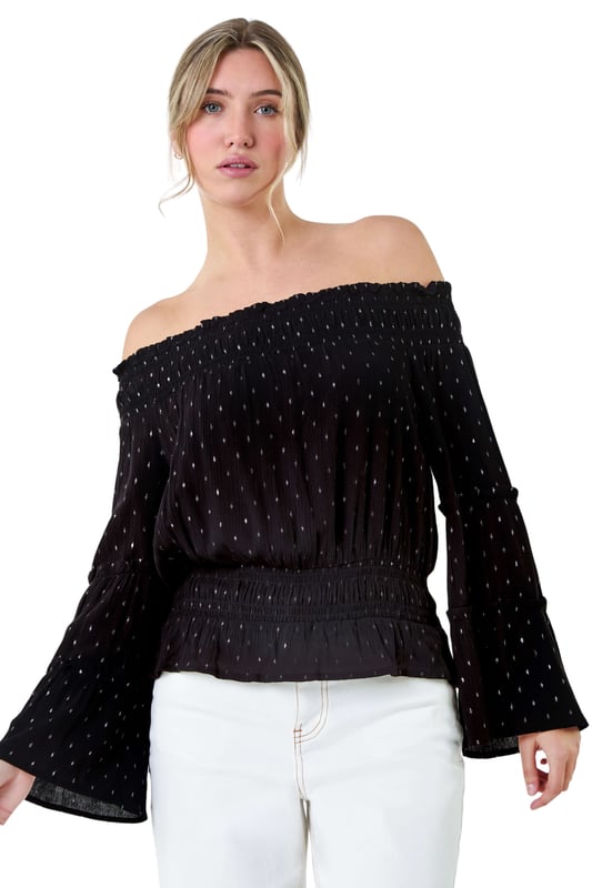 Shimmer Foil Textured Bardot Top from Roman. Shimmer into the new season with this metallic foil print bardot top. With its off-the-shoulder neckline and tiered sleeves, it exudes effortless Summer elegance. Made from a crinkle woven fabric, this top will keep you cool and comfortable on warm days with its relaxed bardot finish. The shirred stretch neck and waist provide a flattering fit, while the frill hem adds a feminine touch. Pair it with matching wide leg trousers (18061508) from our Dusk Collection for a chic and coordinated look or with denim jeans for casual Spring looks.
