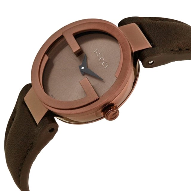 General: Color: Brown Case: Case Size: 29 mmCase Thickness: 6 mmCase Material: Stainless SteelCase Shape: RoundCase Back: Solid Band: Band Material: Calfskin LeatherBand Type: StrapBand Color: BrownBand Length: 7 inchesBand Width: 14 mmClasp: Tang Dial: Dial Color: BrownType: AnalogCrystal: Scratch Resistant SapphireHands: BlackSecond Markers: No Markers. The Gucci name appears below the 12 o'clock position Bezel: Bezel: Fixed Interlocking GBezel Color: Brown PVDBezel Material: Stainless Steel Crown: Crown: Pull / Push Information: Brand: GucciCollection Name: InterlockingGender: Women'sModel: YA133504Watch Label: Swiss MadeMovement: Quartz Features: Water Resistance: 50 meters / 165 feetFunctions: Hour, MinuteWatch Features: Stainless Steel, Leather, Analog Additional Info: Watch Style: LuxuryUPC Code: 731903334441Sku: YA133504Department: WatchesCategory: Watches