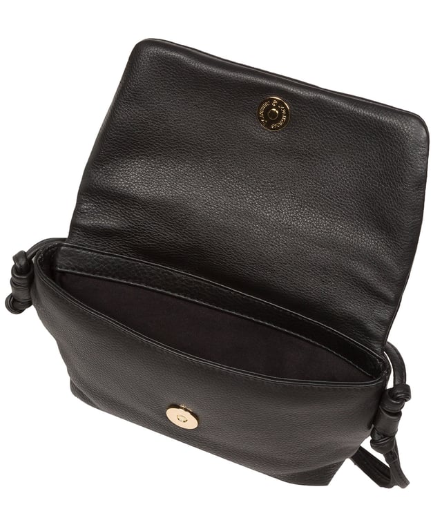 The 'Zoey' cross body bag from the Pure Luxuries London Marylebone Collection is handcrafted from high-quality, genuine Nappa leather with a natural super-soft touch. The fold-over top features an eye-catching quilted design and is secured by a magnetic press stud. The interior is lined with 100% cotton and includes two card slots, to help keep maintain an organised bag. Comes with an adjustable slim leather strap, with a drop length of 65cm. The Pure Luxuries logo is embossed in gold foil for a beautifully simple finishing touch.