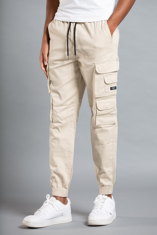 These cargo-style trousers from Tokyo Laundry are wardrobe staples. Made from soft cotton fabric, these trousers are perfect for everyday wear. Featuring two side pockets, four cargo-style pockets and two back pockets, a drawstring with toggle, elasticated waistband and cuffs and Tokyo Laundry branding on the front. Machine washable for easy care.
