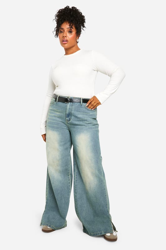 Wide-leg silhouette for a relaxed, on-trend look
        Vintage wash effect adds character and depth
        High-rise waist for a flattering fit
        Roomy pockets for practicality
        Versatile denim fabric suitable for various occasions
    
    Make a bold statement with these plus-size wide-leg jeans from Boohoo. The vintage wash lends a lived-in charm, perfect for achieving that coveted effortless style. The high-rise waist cinches you in at your smallest point, creating a flattering silhouette that pairs beautifully with both cropped tops and tucked-in blouses. For a casual daytime look, team with a simple white tee and trainers. When the evening calls, dress them up with a silky camisole and heeled mules. The roomy leg allows for maximum comfort and movement, ideal for family gatherings or casual Friday at the office. These jeans are a versatile wardrobe staple that can be styled countless ways, making them a must-have for the fashion-forward woman who values both style and comfort.