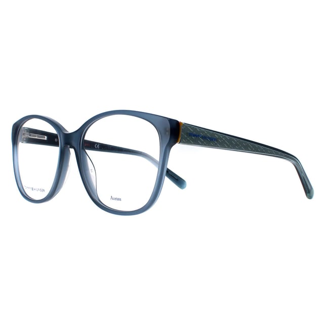 Tommy Hilfiger Square Womens Blue Glitter TH1780  Glasses feature a lightweight and durable square frame that provides a comfortable and secure fit. The temples are adorned with the iconic Tommy Hilfiger logo, adding a touch of elegance and sophistication to the overall look.
