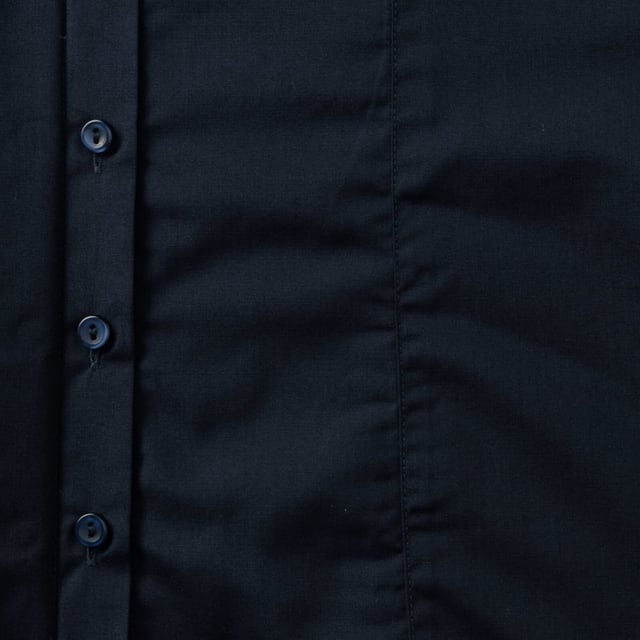 One of the great classic shirt fabrics, combining elegance with durability and wearer comfort. Smart and stylish fitted shirt design in a fine poplin fabric. Concealed placket. Stylish yoke design. Darts on bust front hem and back panel for fitted shape. Decorative top stitch on darts. Modern rounded 2 button cuffs. Rounded hem. The elegant lightweight fabric is especially suited for finer embroideries. Also available in mens sizes, code 924M. Weight: 110- 115g/m². Fabric: 65% Polyester, 35% Cotton. XS (30-32: To Fit (ins), 8: Dress Size). S (32-34: To Fit (ins), 10: Dress Size). M (34-36: To Fit (ins), 12: Dress Size). L (36-38: To Fit (ins), 14: Dress Size). XL (38-41: To Fit (ins), 16: Dress Size). 2XL (41-44: To Fit (ins), 18: Dress Size). 3XL (44-47: To Fit (ins), 20: Dress Size). 4XL (47-51: To Fit (ins), 22: Dress Size). RUSSELL COLLECTION - a variety of Mens and Womens corporatewear in a wide range of styles, colours and sizes.
