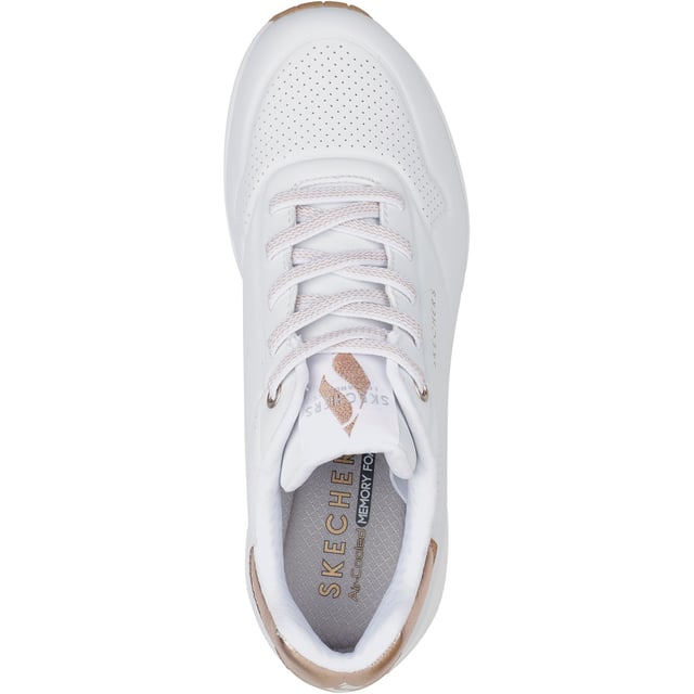 Slip-on a classic style in comfort wearing Skechers Street Uno - Shimmer Away. This fashion sneaker features a synthetic durabuck upper with a metallic trim, stretch laces, Skechers Air-Cooled Memory Foam insole and Skech-Air visible airbag midsole.