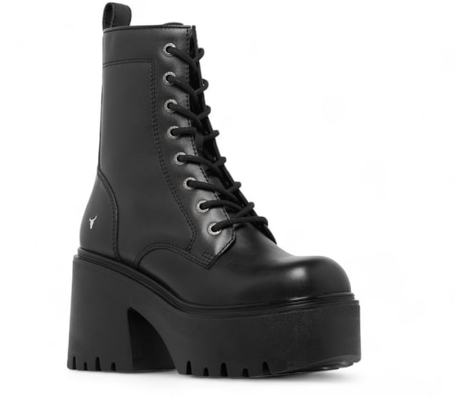 Step into bold fashion with the Totally Black Platform Boots, designed to make a statement with every stride. These chunky lace-up boots feature a robust black leather upper that exudes confidence and style. The round toe design and eye-catching bull symbol on the upper add a unique flair, while the inside zipper ensures easy wear.

Key Features:

Chunky Heel and Platform: A striking heel height of 9 cm combined with a 4.6 cm platform gives you an elevated look without sacrificing comfort.
Durable Black Leather Upper: Crafted from high-quality black leather, these boots provide both style and durability for everyday wear.
Lace-Up Design: The adjustable lace-up feature allows for a customizable fit, ensuring both comfort and security.
Cleated Sole: The cleated sole provides excellent grip and traction, making these combat boots perfect for any terrain.
Non-Leather Lining: Designed with a non-leather lining for enhanced breathability and comfort during all-day wear.
Whether you're dressing up for a night out or adding edge to your casual look, the Totally Black Platform Boots are the perfect blend of style and practicality. Embrace your inner warrior and make every outfit a bold fashion statement!
