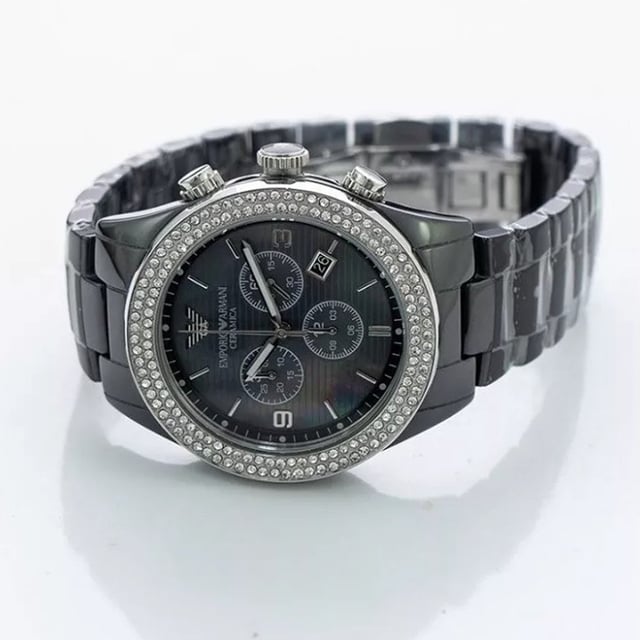 Japanese Made Quartz Chronograph Movement. 43mm x 11mm Black Polished Ceramic Case. Solid Stainless Steel Caseback and Crystal Set Bezel. Push-Pull Crown. Black Mother of Pearl Dial. Luminous Stainless Steel Hands and Arabic Numbered Indexes. Date At 4 O'Clock. 3 Sub-Dials. 21mm Width Black Ceramic Bracelet with Hidden Deployment Clasp. Water Resistant to 30 Meters 3ATM. This watch is , comes with the correct Box and Paperwork and 2 Years International Warranty.