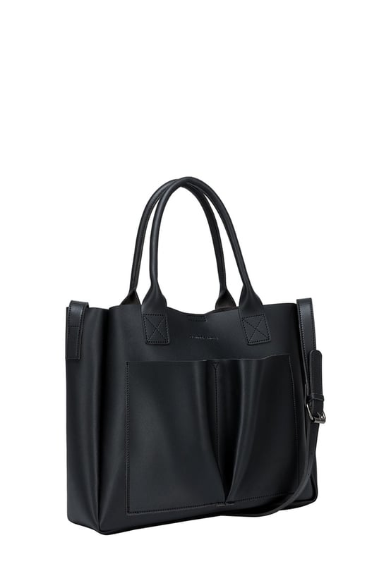 Be anything but basic with this classic wardrobe staple. The Megan XL Tote is the perfect accessory for making a statement and is highly functional too. Inside is a spacious compartment, big enough to carry the days essentials. You can also find a pouch which can be removed, ideal for storing items you want to keep extra secure, or use it as a mobile makeup bag! You have a choice of styling with the tote grab handles and the adjustable shoulder strap, so you can change your look depending on your chosen style! Features: , Lightly textured PU exterior, Claudia Canova debossed logo, Magnetic clasp fastening, Two exterior slip pockets, 2 x tote grab handles, Adjustable shoulder strap, Interior pouch which can be removed using the snap button clasps, Pouch measurement: W 304 x H 203 x D 63 mm, Zip top fastening on interior pouch Style Ref: 84607 BLACK
