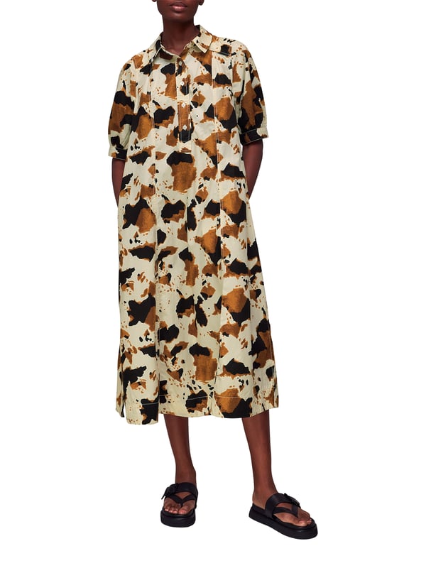 Embrace the statement look with our Cow Print Midi Shirt Dress, perfect for daytime flair or a casual weekend ensemble.