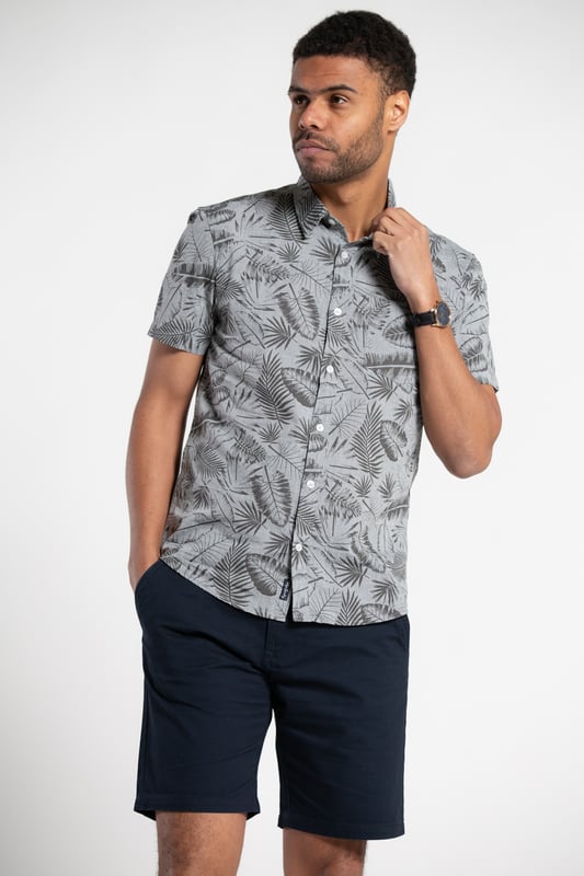 Brighten up your wardrobe with this printed chambray shirt from Tokyo Laundry. Made from 100% cotton, this short-sleeved button-down is perfect for any occasion. The funky design features a comfortable fit, and stylish look. Add this versatile staple to your wardrobe today. Machine washable for easy care.
