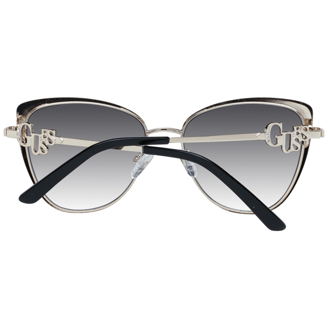 Guess Cat Eye Womens Black Grey Gradient GF6141  Sunglasses are a classy cat eye frame shape, exuding a sense of timeless elegance. The frame is crafted from high-quality metal, known for its durability and lightweight feel, ensuring long-lasting comfort throughout the day. Slender temples feature the Guess logo for a touch of sophistication.