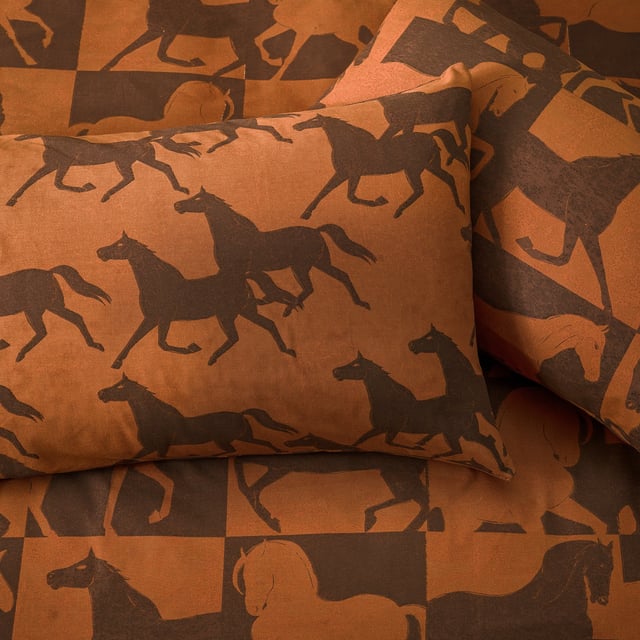 Inspired by the notion of wild horses galloping free in the desert, Herve draws from ancient ideas that painted running horses are meant to welcome good fortune, peace, and riches in the home. This design is reversible, with one side showing the horses in patchwork while the other depicts them running free, perfect for a midweek refresh.