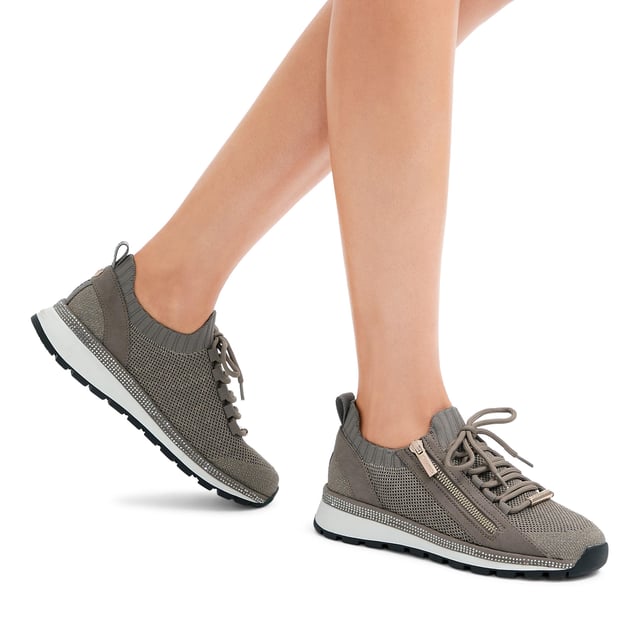 This Carvela Pace Zip Knit trainer features a bronze fabric upper with slight glimmer. The front laces are tubular with a gold zip on the eye stay. There is a silver crystal panel around the midsole.