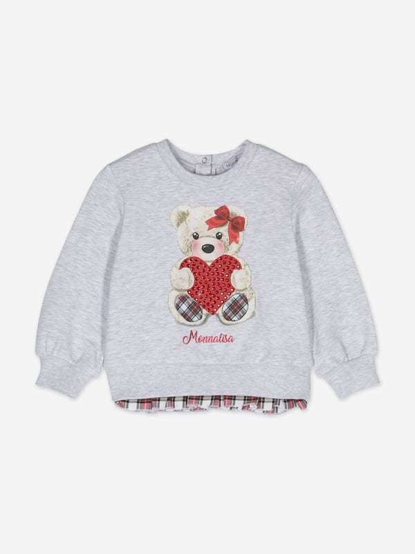 Monnalisa incorporate passion and innovation into their beautifully crafted designs. This baby girls teddy bear sweatshirt in grey is perfect for every fashionista. Depicted with a whimsical teddy bear graphic holding a red sequin adorned heart. It showcases an elasticated waistband, cuffs and contrast tartan trim. The sophisticated piece is complete with elegant 'Monnalisa' printing in scarlet. Pair with matching joggers. ‚ Round Neck‚ Long Sleeved‚ Press-Stud Fastening‚ 95% Cotton, 5% Elastane
