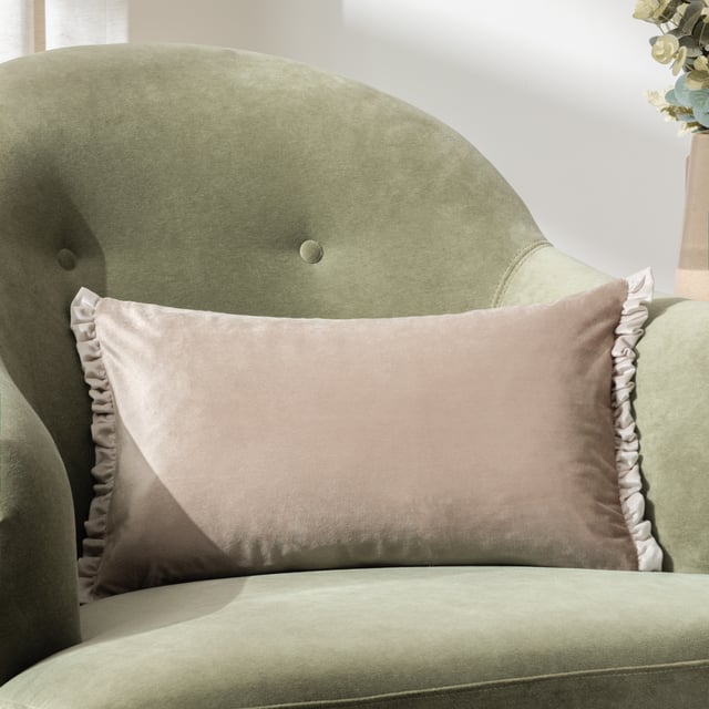 The Tilly cushion is made entirely of soft, opulent velvet and comes in a variety of soft pastel colours to help create a sophisticated look for your sofa. The dual-sided cottage core frill trim adds gravitas to the design, making it easy to combine with other larger cushions as part of a larger design scheme.