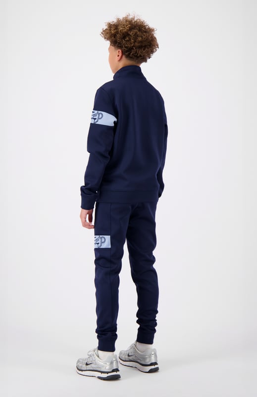 100 % Polyester Normale Passform Hoher Kragen mit halbem Reißverschluss Black Bananas Signatur-Klappe auf der Vorderseite Commander-Band am linken Arm Kombinierbar mit JR. COMMANDER TRACKPANTS 