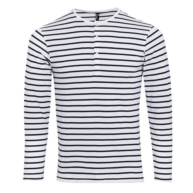 Langarm-T-Shirt. Mit rollbaren Ärmeln und einer Knopfleiste an der Innenseite des Ärmels, um es zu fixieren. Rundhalsausschnitt mit Knopfleiste mit drei Knöpfen. Doppelnähte an Saum und Bündchen. Waschanleitung: Haushaltswäsche bei 40 Grad.
