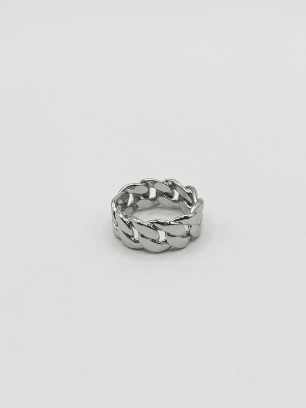 The ring's polished finish enhances its sophisticated appeal, making it a versatile accessory suitable for any occasion. Whether worn as a statement piece or a subtle nod to one's heritage, this Cuban silver ring embodies timeless style and cultural pride.  Ring Size 9. Stainless Steel.