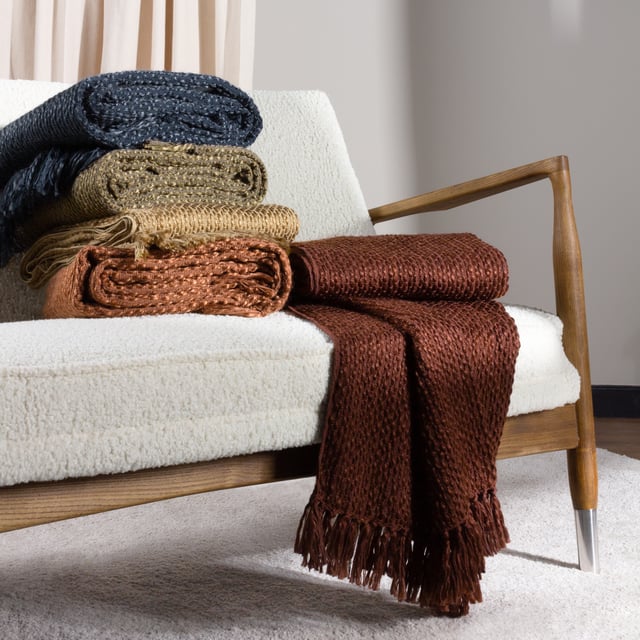 In muted earthy tones and solidly crafted from super soft, woven blends of yarn, the Morni throw instantly creates a warm, understated style for your soft furnishings. The design is complimented by tassel fringing on two sides and is ideal if you love to build up textures within a modern, neutral interior.
