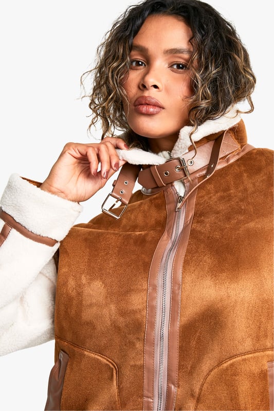 Take your outfit to new style heights with an aviator jacket. Perfect for layering, create a stylish oversized silhouette as you choose from crop belted jackets to faux fur lined options. A cross between a classic flight jacket and a leather biker, it's all about the detailing with this snug winter staple. Pair your aviator coat with high waisted mom jeans or a mini skirt with tights and boots - the options are endless...Style: Aviator Jacket