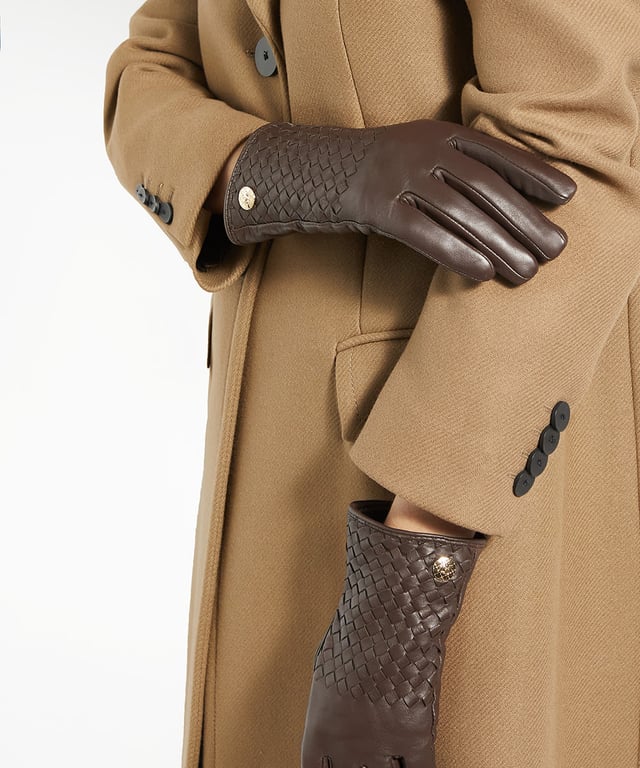 Elevate your winter wardrobe with Idols, exquisite woven leather gloves crafted from premium leather. Designed with stylish woven details and gold Dune London branding at the wrist for a sophisticated touch, these gloves are more than just a practical accessory on chilly days.
