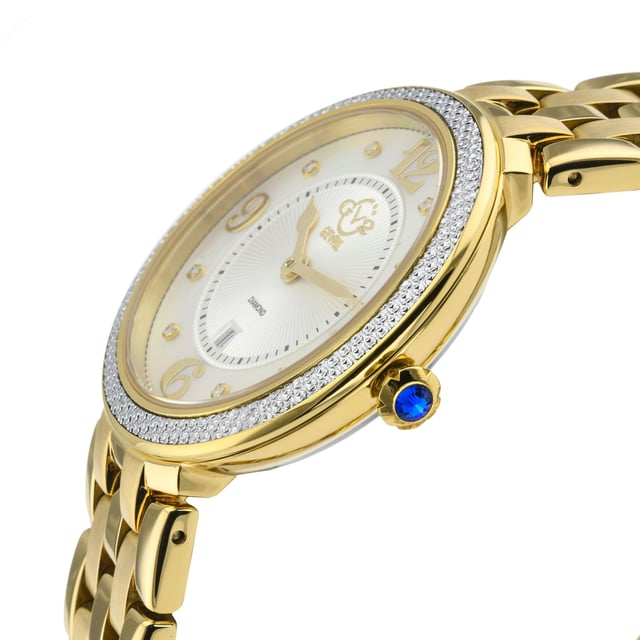 Crafted of a long, rich history and dazzling with its subtle charm, GV2’s Verona Collection is the best of what a women’s watch can be. A soft, powerful touch that delights the eye, the Verona Collection is for the romantic inside all of us.  Like the quaint town in Northern Italy, Verona timepieces stand the test of time using Swiss Quartz Movement. Brilliantly radiant while understated and restrained, the elegant design features curly, script numbering on the 3,6,9 and 12 markers adding soft touches over powerful fabrication. The 37mm diamond cut bezel contains a mother of pearl face with 8 stunning diamonds on the dial protected by anti-reflective sapphire crystal completing a design that would inspire Shakespeare.  In fair Verona, while romance leads, the construction harkens to an ancient past that is decidedly modern. Adorned with a push pull fluted crown in blue Cabochon stone, a nod to the city by the river, each Verona watch is secured with a braided bracelet and deployment buckle befitting ancient Roman ruins and stunning Medieval Architecture.  Whether strolling through the piazza, taking in an opera at the amphitheater or sightseeing through the mini coliseum, GV2’s fair Verona Collection inspires love at first sight.

GV2 12901B Women's Verona Swiss Diamond Watch

GV2 Women's Swiss Quartz Watch from the Verona Collection
37mm SS/IP Light Gold Diamond Cut Bezel Case
8 Diamonds on White MOP Dial, Gold Indices
Push Pull Fluted Crown with Blue Cabochon Stone
IP Light Yellow Gold Bracelet With Deployment Buckle
Anti-reflective Sapphire Crystal
Water Resistant to 50 Meters/5ATM
Swiss Quartz Movement Ronda 784