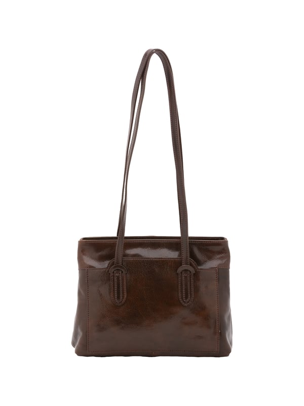 Bolso bandolera para mujer. El cierre es con cremallera. Los bolsillos internos son uno con cremallera. Los bolsillos externos son un frente abierto. Falta la correa para el hombro. El mango es de piel. Hay dos compartimentos internos. El material exterior es auténtica piel de vacuno. Internamente está forrado en algodón. Medidas: 23x30x12 cm. Hecho en Italia
