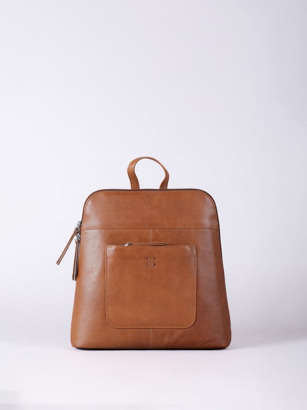 The Talkin handbag collection is a study in sleek sophistication, and this practical backpack is no exception. Crafted from soft premium leather, this classic style has plenty of space to ensure you can carry all your essentials with ease. The adjustable leather straps offer unparalleled comfort, and we've included a grab handle for convenient carrying.