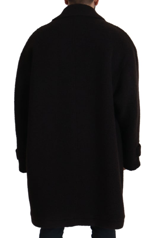 100% authentiek Dolce & Gabbana donsjack met knopen
  Vervaardigd in Italie
  Volledige knoopsluiting
  Strakke zwarte kleur
  Logo details
  Materiaalsamenstelling: 45% Alpaca 45% Wol 10% Nylon
  Voering: 100% Viscose