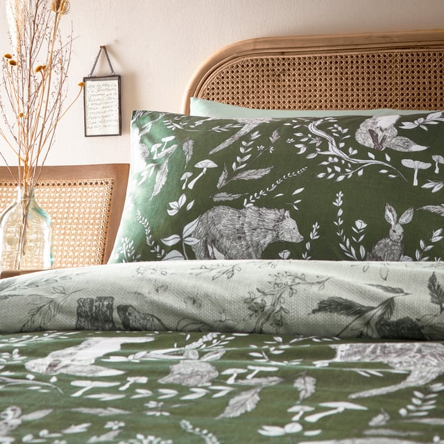 Explore our cosy and delicate take on the beauty of woodland creatures as you rest in the Buckthorn duvet cover set. Hand-drawn rabbits, foxes and bears pose among the delicate florals, which are set on an earth toned background. Flip the set over and the same design appears, but this time in inverted colours, giving you a fresh, evergreen look. An adorable and down to earth addition to your bedroom.
