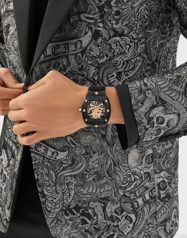 This Philipp Plein The $keleton Crystal Analogue Watch for Men is the perfect timepiece to wear or to gift. It's Grey  Tonneau case combined with the comfortable Grey Plastic watch band will ensure you enjoy this stunning timepiece without any compromise. Operated by a high quality Quartz movement and water resistant to 5 bars, your watch will keep ticking. In pursuit of the perfect design, Philipp Plein’s most iconic watch is given a new and modern twist to create advanced and unmistakable aesthetic codes. High quality 21 cm length and 26 mm width Grey Plastic strap with a Buckle Case measurement: 42 X 44 mm,case thickness: 14 mm, case colour: Grey and dial colour: Multicolour