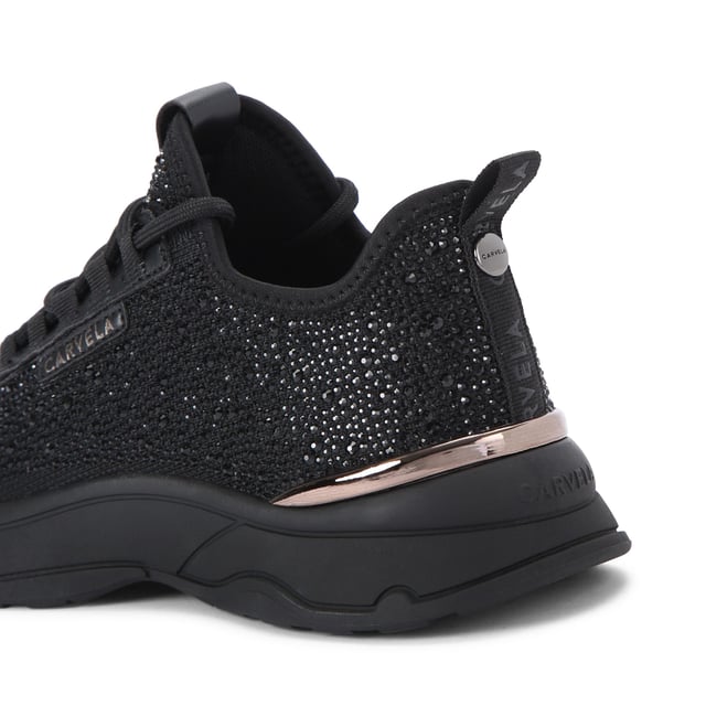 This Carvela Swift Jewel Runner trainer features a black fabric upper with black crystal embellishment. The front laces up with gold foil branding on the tongue and eyestay.