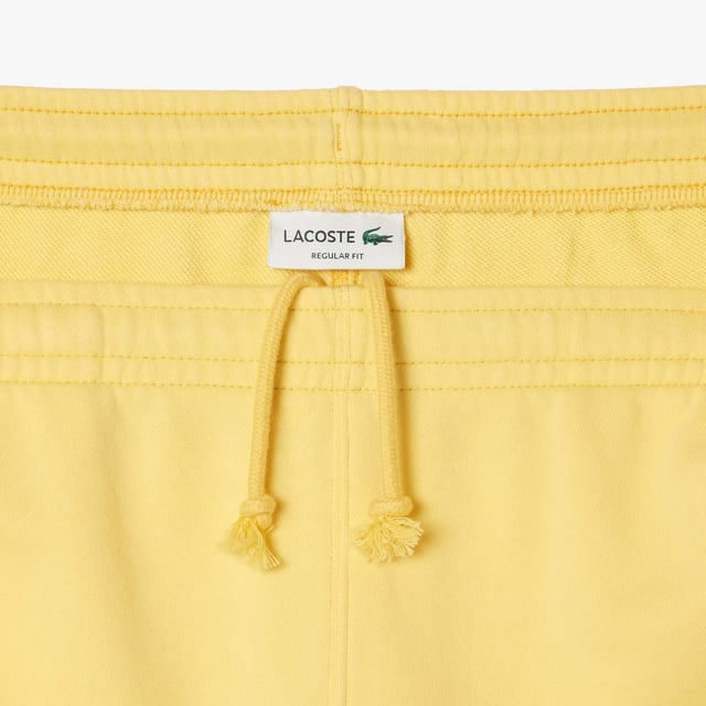 Washed Effect Lacoste Print Jogger Shorts Organic cotton fleece Regular fit  straight cut  Drawstring waist Contrast Lacoste print Embroidered crocodile on front Washed Effect Lacoste Print Jogger Shorts Organic cotton fleece Regular fit  straight cut  Drawstring waist Contrast Lacoste print Embroidered crocodile on front
