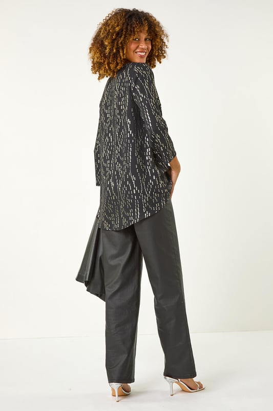 Dotted Foil Blouse from Roman. Sparkle and shine in this stunning dotted foil blouse, perfect for the Autumn/Winter season. The V-Neckline and long sleeves with cuff detail add a touch of elegance, while the mini frill detail around the neckline brings a fun element to this blouse. The foiled fabric gives a glamorous twist to the classic blouse style. Pair it with jeans and heeled boots for a chic and stylish look that will turn heads wherever you go!