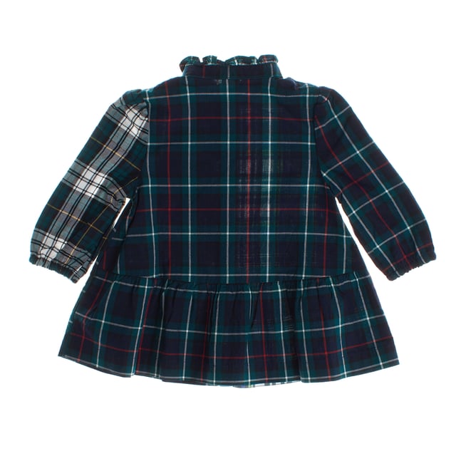This shirt dress perfectly combines classic and modern style.

 Made of soft flannel fabric, it stands out for its checkered design in different patterns, which create an original and striking contrast.

 The round neckline, adorned with subtle gathers, adds a delicate touch, while the front button closure maintains the functional and timeless essence of this type of garment.

 It features a patch pocket on the chest, a practical and decorative style that attaches to the garment without closures or flaps.

 Long sleeves with elastic cuffs ensure a comfortable fit, and the layered skirt adds movement and a dynamic touch.

 Ideal for a casual yet stylish look, this dress is a versatile option and perfect for everyday wear.
 Composition: 100% Cotton
 Care:
- Hand wash or delicate cycle.
 - Use mild detergents.
 - Do not use a dryer.
 - Iron at low temperature.
 - Do not dry clean.