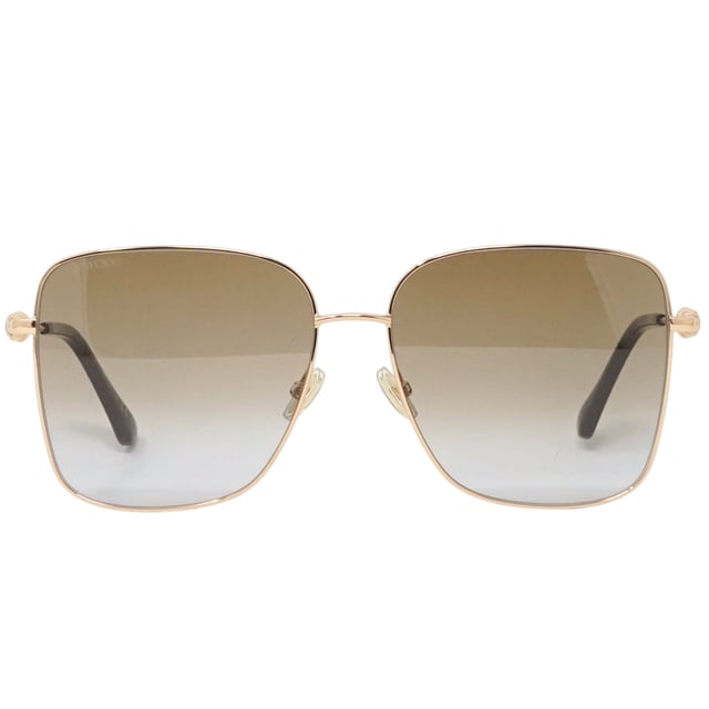 Jimmy Choo Hester V01 Gold Sunglasses. Experience luxury and sophistication with the Jimmy Choo Hester V01 Sunglass. Crafted from the finest materials, these sleek sunglasses feature 100% UVA/UVB protection and refined metallic accents. Admire the sophisticated Jimmy Choo style with these timeless sunglasses.. Gold Sunglass, Nose Bridge Width = 15mm, Lens Width = 59mm, Arm Length = 145mm. Branded Sunglasses Case and Cleaning Cloth Included. 100% Protection Against UVA &amp; UVB Sunlight and Conform to British Standard EN 1836:2005, Sunglasses, Sunglasses Case, Cleaning Cloth and Care Instructions all Included. Jimmy Choo Hester V01 Sunglass