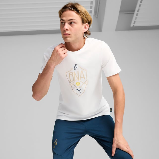 PRODUCT STORY : Unleash your inner Neymar. This bold tee lets you represent the Brazilian legend's natural-born talent. With metallic prints reflecting his signature style, you'll dominate like the man himself every time you step onto the pitch. The "BNA" collection stands for Brazilian Natural Abilities, playing on the DNA that is naturally embedded into such great footballing talent and the culture where Neymar Jr comes from. FEATURES & BENEFITS :  Made with at least 20% recycled cotton.  DETAILS :  Regular fit. 160 gsm, Jersey. Rib crew neck. Short sleeves. PUMA branding details.  Our model is 188 cm tall and is wearing size  M UK.