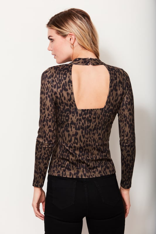 A wild new take on the classic high neck top, if you love it from the front, just wait until you see the back. The khaki leopard print has a sexy cut out detail, but don’t worry, you can still wear a bra. Pair it with our leather culottes for a trend ticking look you can wear anywhere.