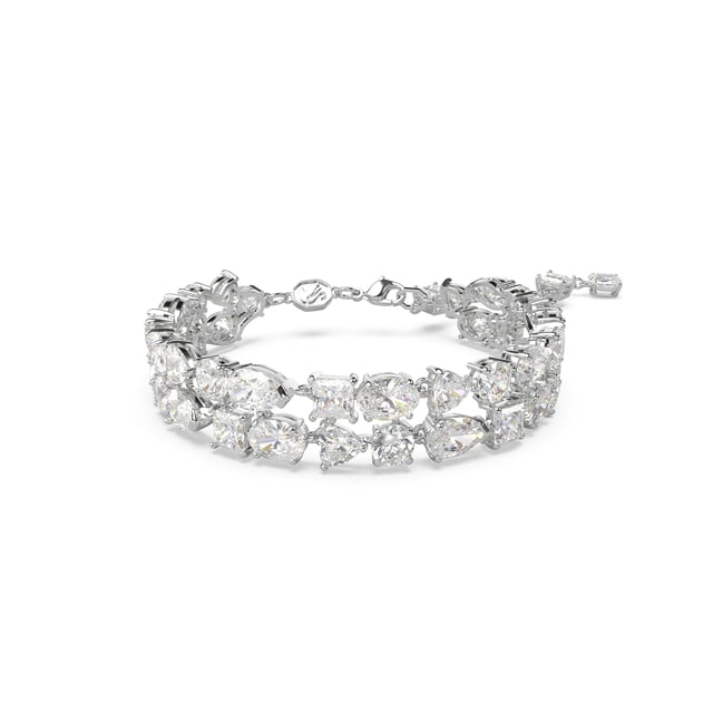 This dazzling Bracelet for Women from Swarovski is the perfect gift to spoil yourself or a loved one. The Bracelet is made out of Base Metal, colored Silver at Length: 19.5 cm weighing in at  grams with a Width of 1.4 cm at its widest point. The Swarovski 'Mesmera' Women's Base Metal Bracelet - Silver 5669927 is delivered in a stunning gift box and carries a two year warranty.