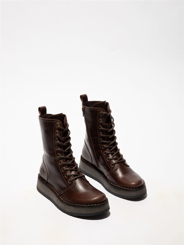 The Fly London RAMI043FLY Casual Lace-Up Ankle Boots offer a stylish yet practical addition to your footwear collection. Crafted from high-quality leather with a soft microfiber lining, these boots provide all-day comfort and abrasion-free wear. The classic lacing system is paired with a convenient side zip for easy on/off. Featuring a foam-padded, microfiber-lined footbed and a durable rubber wedge sole. These boots ensure cushioning, grip, and traction, Perfect for everyday use, Premium leather upper with soft microfiber lining, Lace-up with side zip for easy wear Cushioned, Foam-padded footbed, Durable rubber wedge sole for grip, Flat heel for all-day comfort.