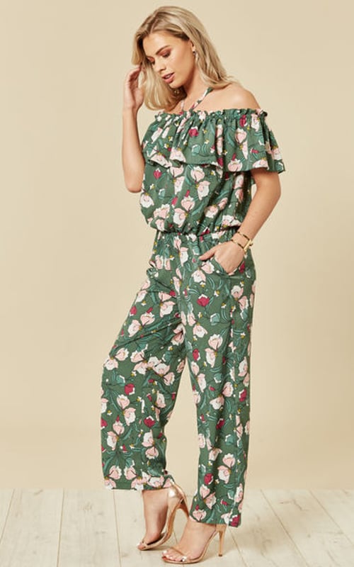 Embrace Spring florals with the Dreaming of Maui off the shoulder jumpsuit. With a ruffle off the shoulder neckline, relaxed fit and a halterneck tie, though the jumpsuit can also be worn without the necktie.