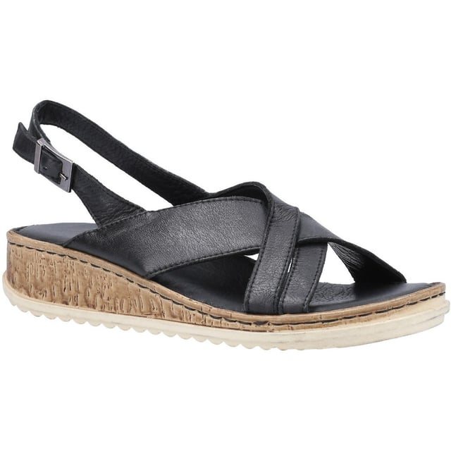 Hush Puppies Elena Sandalias Relájate y pasa el día con estas cómodas sandalias de verano de Hush Puppies. Este par presenta un diseño de tiras cruzadas sobre una cómoda plantilla. combinado con una suela con cuña y agarre. Disfruta del verano con estas súper cómodas. sandalias versátiles.