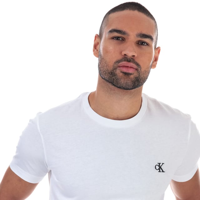 Mens Calvin Klein Jeans Essential Slim Organic Cotton T-Shirt in bright white.<BR><BR>- Ribbed crew neck.<BR>- Short sleeves. <BR>- Embroidered Calvin Klein monogram logo at left chest.<BR>- Soft organic cotton jersey construction.<BR>- Slim fit. <BR>- 100% Organic cotton.  Machine washable.<BR>- Ref: J30J314544YAF