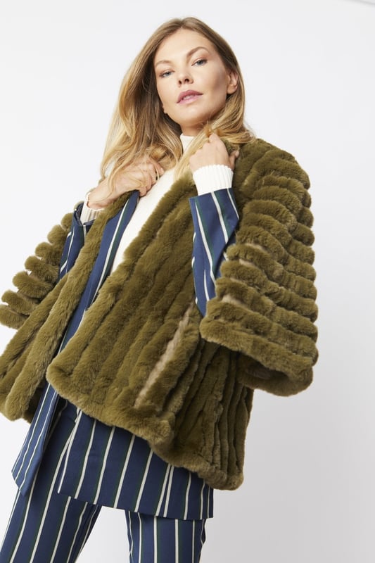 Please note all One-Size Jayley products comfortably fit sizes 8-14. An elegant knitted striped faux fur coat with flared open sleeves. A luxury top layer to compliment any outfit.