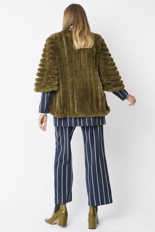 Please note all One-Size Jayley products comfortably fit sizes 8-14. An elegant knitted striped faux fur coat with flared open sleeves. A luxury top layer to compliment any outfit.