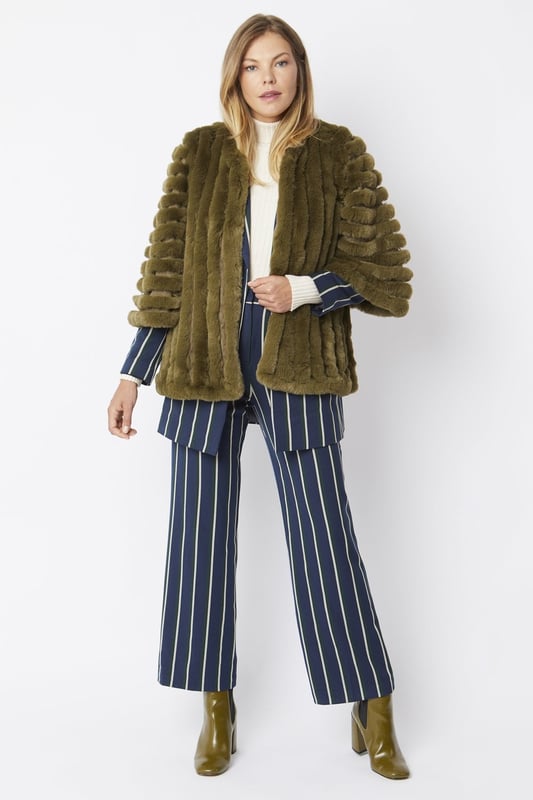 Please note all One-Size Jayley products comfortably fit sizes 8-14. An elegant knitted striped faux fur coat with flared open sleeves. A luxury top layer to compliment any outfit.