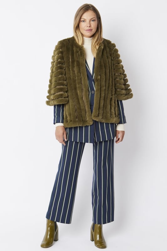 Please note all One-Size Jayley products comfortably fit sizes 8-14. An elegant knitted striped faux fur coat with flared open sleeves. A luxury top layer to compliment any outfit.