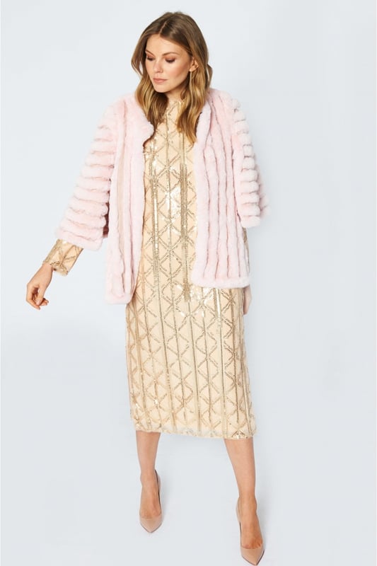 Please note all One-Size Jayley products comfortably fit sizes 8-14. An elegant knitted striped faux fur coat with flared open sleeves. A luxury top layer to compliment any outfit.
