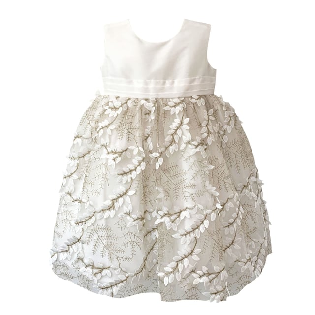 Another new style for us this year. We are so excited to have sourced the beautiful fabric for this style LUCY.

Fern style embroidered leaves in ivory, attached by gold thread stems. The gold catches in the light as the skirt moves and has a 3D effect which makes the leaves look realistic. A very distinctive fabric makes this girls special occasion dress quite unique. You won't see another dress like this on the high street!

The top of the dress is made using our 'Mock Silk' fabric and has a pin tucked sash that ties at the back in a big bow. It's fully lined in lightweight soft 100% cotton, just in case your little one has sentitive skin and also helps them not to get too sweaty after all the twirling and pirouetting around. Let's be honest ... all girls will feel like a princess in this!

All our dresses arrive with you on a satin padded hanger to help keep the dress in the best shape and then protected by one of our heritage garment keepsake bags
Outer - 100% Polyester
Lining - 100% Cotton
Dry Clean or Hand Wash only